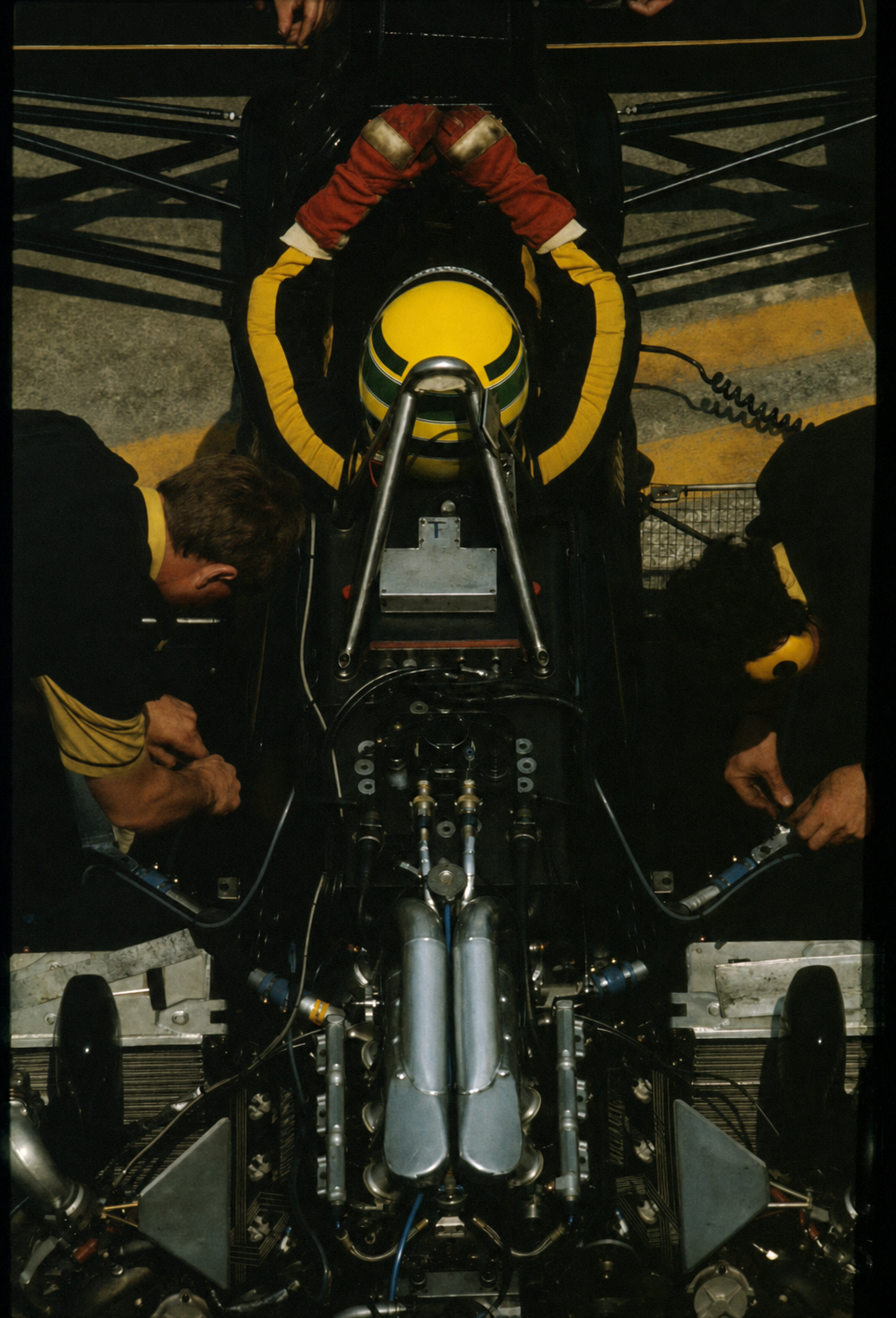 Ayrton Senna in the cockpit with his engineering team